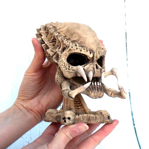 Predator skull scale resin replica on bone skull base